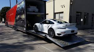 Loading a car into a container for a move to Costa Rica